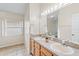 Bright bathroom featuring double sinks and a vanity with great lighting at 536 Cheshire Way, Davenport, FL 33897