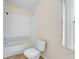Well-lit bathroom features a shower-tub combo and standard toilet at 536 Cheshire Way, Davenport, FL 33897