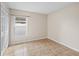 Neutral bedroom showcasing a window and closet with tile floors at 536 Cheshire Way, Davenport, FL 33897