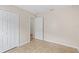 Bedroom with tile floors, closet and access to an adjacent room at 536 Cheshire Way, Davenport, FL 33897