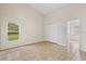 Sunny bedroom offering ample space, tile floors, and a view of the backyard, creating a serene retreat at 536 Cheshire Way, Davenport, FL 33897