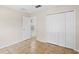 Bedroom with closet, access to an adjacent room, and tile flooring at 536 Cheshire Way, Davenport, FL 33897