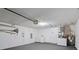 Clean and well-lit garage with laundry area and water heater, offering practical convenience at 536 Cheshire Way, Davenport, FL 33897