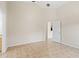 Bright living room featuring neutral walls and a large tiled floor at 536 Cheshire Way, Davenport, FL 33897