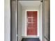 Close-up of the elegant, decorative front door with six raised square panels, framed by the doorway at 1060 Colony Park Dr, Lakeland, FL 33813
