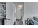 Hallway with wood floors, white walls, and access to closets at 1060 Colony Park Dr, Lakeland, FL 33813