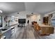 Spacious living area with wood floors seamlessly connected to the kitchen and dining area at 1060 Colony Park Dr, Lakeland, FL 33813