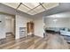 Open concept living room featuring hardwood floors and a seamless transition to the kitchen and dining areas at 1060 Colony Park Dr, Lakeland, FL 33813