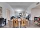 Bright open space with wood floors, modern chandelier, and access to the backyard patio at 1060 Colony Park Dr, Lakeland, FL 33813
