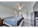 Bright main bedroom featuring carpeted floors, ceiling fan, and ensuite bathroom at 1060 Colony Park Dr, Lakeland, FL 33813