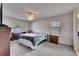 Serene main bedroom featuring carpeted floors, ceiling fan, and natural light at 1060 Colony Park Dr, Lakeland, FL 33813