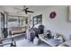 Covered outdoor patio with a ceiling fan, seating, and grilling area for entertaining at 1060 Colony Park Dr, Lakeland, FL 33813