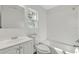 Bright bathroom featuring a combined shower and tub with white subway tile, a modern vanity, and a large mirror at 116 Woodlane Ave, Wildwood, FL 34785