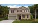 Two-story house featuring a beige exterior, red shutters, and a two-car garage at 693 Peroni Ave, Debary, FL 32713