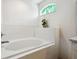 Close up view of the built-in bathtub and window in this bathroom at 8867 Pebblebrooke Dr, Lakeland, FL 33810