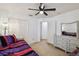 Bedroom featuring closet doors and a bright and modern design aesthetic at 8867 Pebblebrooke Dr, Lakeland, FL 33810