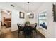 Cozy dining area with a view of the lake from the window, adjacent to the main bedroom at 8867 Pebblebrooke Dr, Lakeland, FL 33810