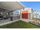 View of a shed, lawn and lake beyond at 8867 Pebblebrooke Dr, Lakeland, FL 33810