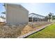 View of the yard, shed and enclosed pool area at 8867 Pebblebrooke Dr, Lakeland, FL 33810