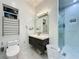 Modern bathroom featuring a shower, toilet, and vanity with sink at 3911 Auburndale Ave, Orlando, FL 32839