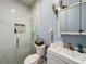 Bathroom featuring a marble shower, updated vanity and modern accents at 3911 Auburndale Ave, Orlando, FL 32839