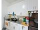 Kitchen area with white cabinetry, granite counters, and modern appliances at 3911 Auburndale Ave, Orlando, FL 32839