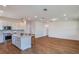 Open-concept living area with hardwood floors and kitchen at 5295 Sw 87Th Ter, Ocala, FL 34481