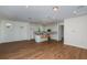 Open-concept living area with hardwood floors and kitchen at 5295 Sw 87Th Ter, Ocala, FL 34481