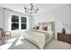 Serene main bedroom with a large window and neutral decor at 5295 Sw 87Th Ter, Ocala, FL 34481