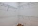 Empty walk-in closet with wire shelving and wood flooring, providing ample storage space at 5295 Sw 87Th Ter, Ocala, FL 34481