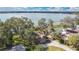 Lovely lakefront house with lush greenery, a private dock, and tranquil lake vistas at 114 Tempsford Rd, Auburndale, FL 33823