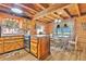 Charming kitchen with wood cabinetry and stainless steel appliances, next to the dining area at 114 Tempsford Rd, Auburndale, FL 33823