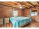 Main bedroom features wood walls, windows, and hardwood floors at 114 Tempsford Rd, Auburndale, FL 33823