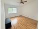 Bright bedroom features a ceiling fan, window, and sleek laminate flooring at 200 Lemon Tree Ln # A, Ormond Beach, FL 32174