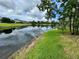 Scenic view of the community pond, reflecting the sky and the neighboring condos at 200 Lemon Tree Ln # A, Ormond Beach, FL 32174