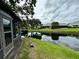 Peaceful view of the pond and the community from the screened-in porch at 200 Lemon Tree Ln # A, Ormond Beach, FL 32174