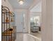 Inviting foyer featuring tile floors, a modern display shelf, and a view into the adjacent living area at 2450 Shelby Ln, Clermont, FL 34711