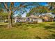 Well-maintained home boasts mature trees and landscaping, and an attached two car garage at 2450 Shelby Ln, Clermont, FL 34711