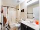 Bathroom featuring a shower-tub combo, vanity with storage, and decor at 331 Marquee Dr, Kissimmee, FL 34758
