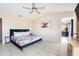 Bright bedroom with a ceiling fan, stylish decor and a view leading to other rooms in the home at 331 Marquee Dr, Kissimmee, FL 34758