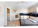 Bedroom with a bunk bed, ceiling fan, closet, tile floors and decor at 331 Marquee Dr, Kissimmee, FL 34758