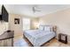 This bedroom has tile floors, a ceiling fan, a window and a television on the wall at 331 Marquee Dr, Kissimmee, FL 34758