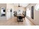 Spacious dining area is furnished with a modern table set, decorative shelving, and plenty of natural light at 331 Marquee Dr, Kissimmee, FL 34758