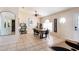 The dining area showcases tile flooring, a modern table set, arched windows, and a stylish welcome sign at 331 Marquee Dr, Kissimmee, FL 34758