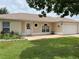 Charming single-story home with a well-manicured lawn, decorative front door, and attached two-car garage at 331 Marquee Dr, Kissimmee, FL 34758