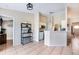 Open concept eat-in kitchen features a coffee bar, bar top seating and stainless appliances at 331 Marquee Dr, Kissimmee, FL 34758
