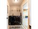 A conveniently located laundry room features black washer and dryer units with storage space at 331 Marquee Dr, Kissimmee, FL 34758