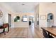 An open-concept interior with a neutral color palette, arched entries, and flowing tile flooring at 331 Marquee Dr, Kissimmee, FL 34758