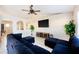 Open-concept living room with tiled floors, ceiling fan, and ample natural light at 331 Marquee Dr, Kissimmee, FL 34758