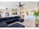 Spacious living room with tile flooring, ceiling fan, and access to the kitchen and dining area at 331 Marquee Dr, Kissimmee, FL 34758